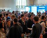 Attendees networking at a tech event