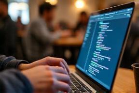 Developer working on code in cafe